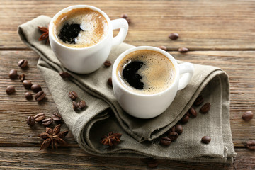 Two cups of coffee on wooden table