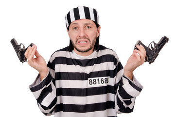 Prison inmate with gun isolated on white