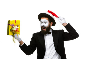 Man with christmas hat and a gift in their hands
