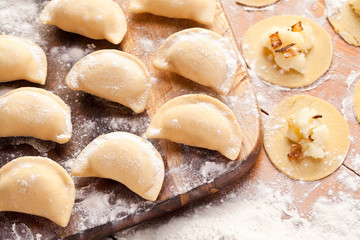 Fototapeta na wymiar Vareniki (dumplings) with potatoes and onion.