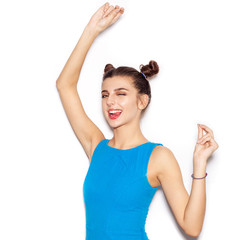 Fototapeta premium Young woman saluting and winking and showing tongue