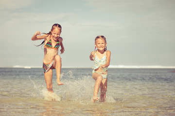 happy children playing on the beach