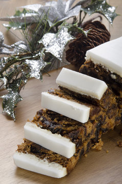 Iced Fruit Cake On A Wooden Board