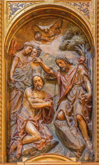 Fototapeta na wymiar Seville - polychrome carved relief of the Baptism of Christ