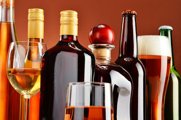 Bottles and glasses of assorted alcoholic beverages
