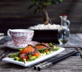 Gentle salad with a salmon, a squid