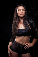 Portrait of young sensuality beautiful woman under the stream of