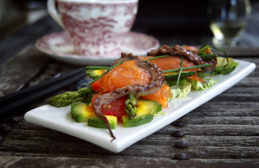 Gentle salad with a salmon, a squid