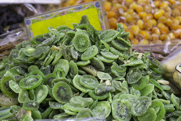 Candied fruits on a market stall. Color image