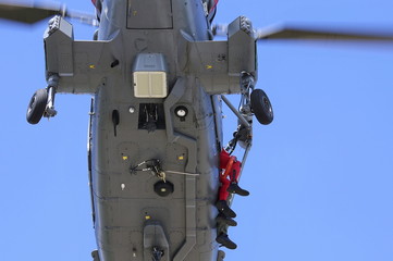 Closeup of the underside of a naval helicopter on a training mis © richardlight