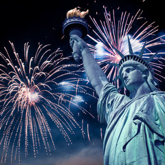 Naklejka premium Statue of Liberty at night with fireworks, New York, USA
