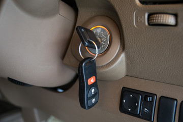 car key in ignition start lock - obrazy, fototapety, plakaty