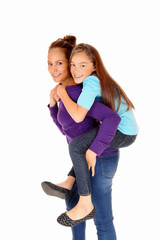 Mother piggyback daughter.