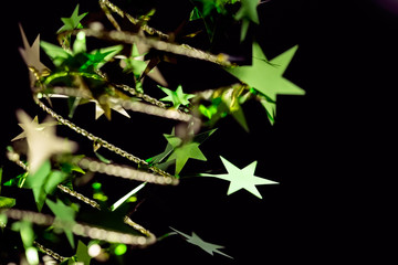 Golden Christmas stars on black background