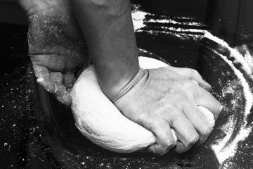 Hands kneading a dough