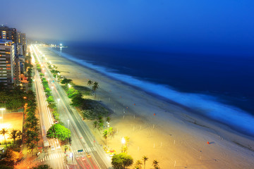 Night view of Ipanema beach after sunset,  with fog from the sea