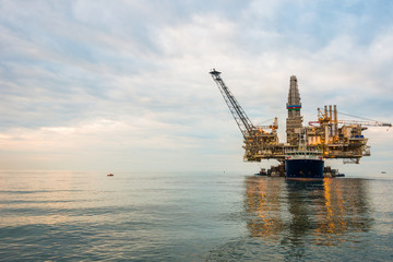 Oil rig platform in the calm sea