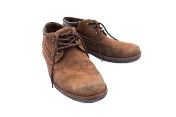 Old brown shoes on white background
