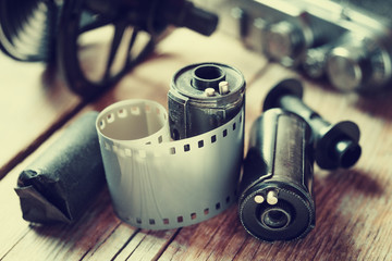 Old photo film rolls, cassette and retro camera.
