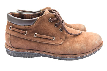 Old brown shoes on white background