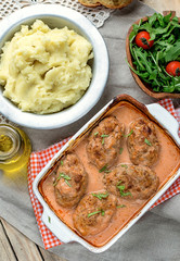 Cabbage and meat balls in tomato sauce