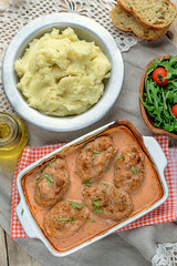 Cabbage and meat balls in tomato sauce