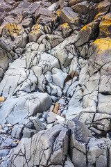 Rocky seashore and stone structure, Holy Island, England