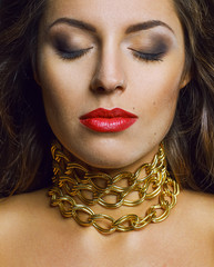 Fashion and emotion portrait of beautiful brunette woman with a