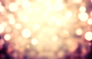 Obraz premium Abstract light celebration background with defocused golden ligh