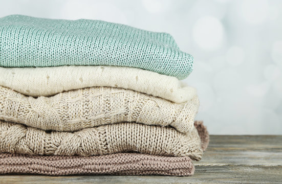 Knitting clothes on light background