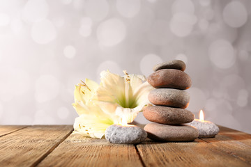Spa stones, candle and white orchid