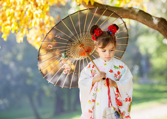 Young kimono girl with traditional umbrella - 73316081