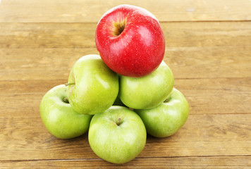 Juicy apples on wooden table
