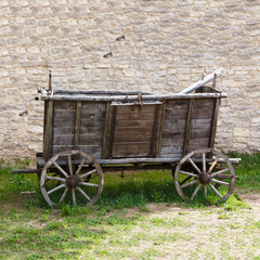Fototapeta na wymiar Empty and old wooden cart