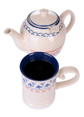 Cup of tea with teapot isolated on white