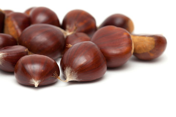 sweet chestnuts isolated on white