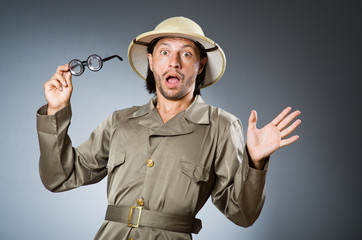 Funny safari hunter against background