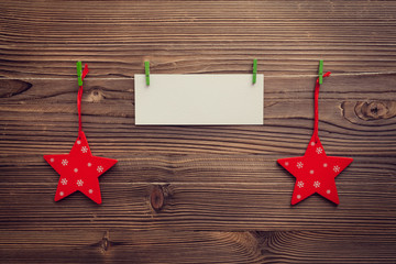 empty greeting card between xmas stars