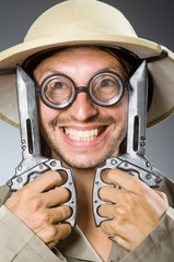 Funny safari hunter against background
