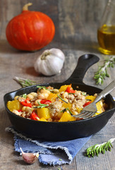 Stew from pumpkin,beans and ground meat with rosemary.