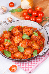 Meatballs with tomato sauce in a pan