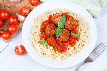 Spaghetti with meatballs in tomato sauce