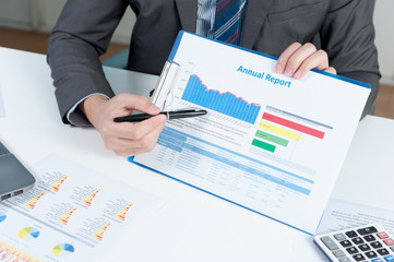Businessman show annual report, business performance concept