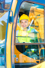 Asian shovel excavator driver on construction site