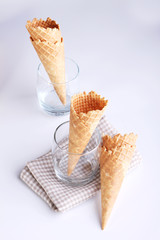 ice cream cones in clear glasses on white background