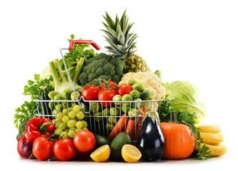 Shopping basket with assorted raw organic vegetables over white