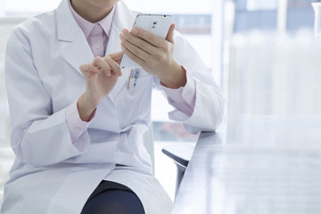 Doctors are using a mobile phone in the medical office