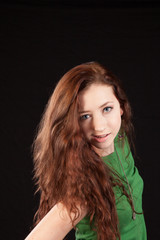 Fototapeta premium woman in green blouse, smiling at the camera