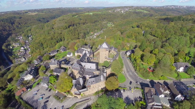 Old European village knights castle aerial, medieval walls town