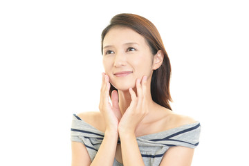 Fototapeta premium フェイスケアをする女性